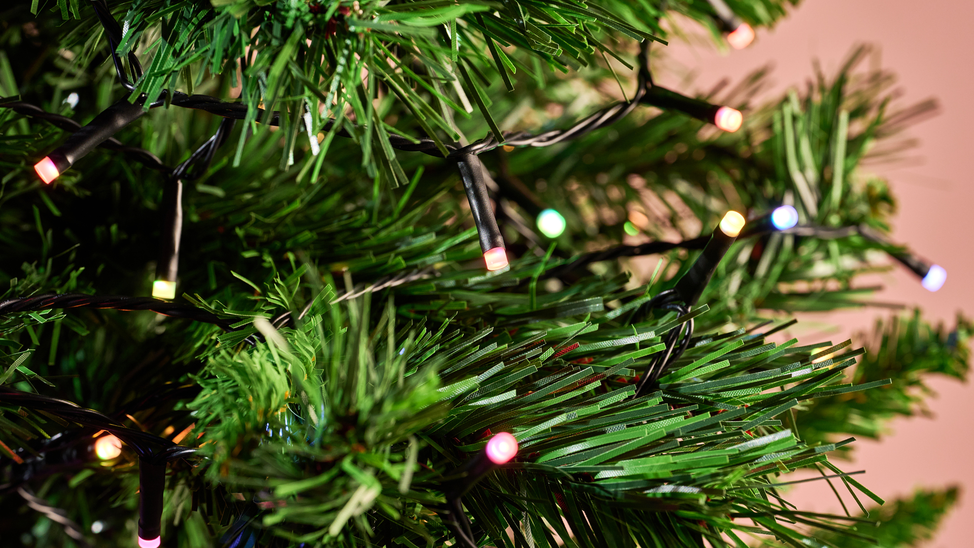 A close-up of the Philips Hue Festavia String Lights on a Christmas tree.