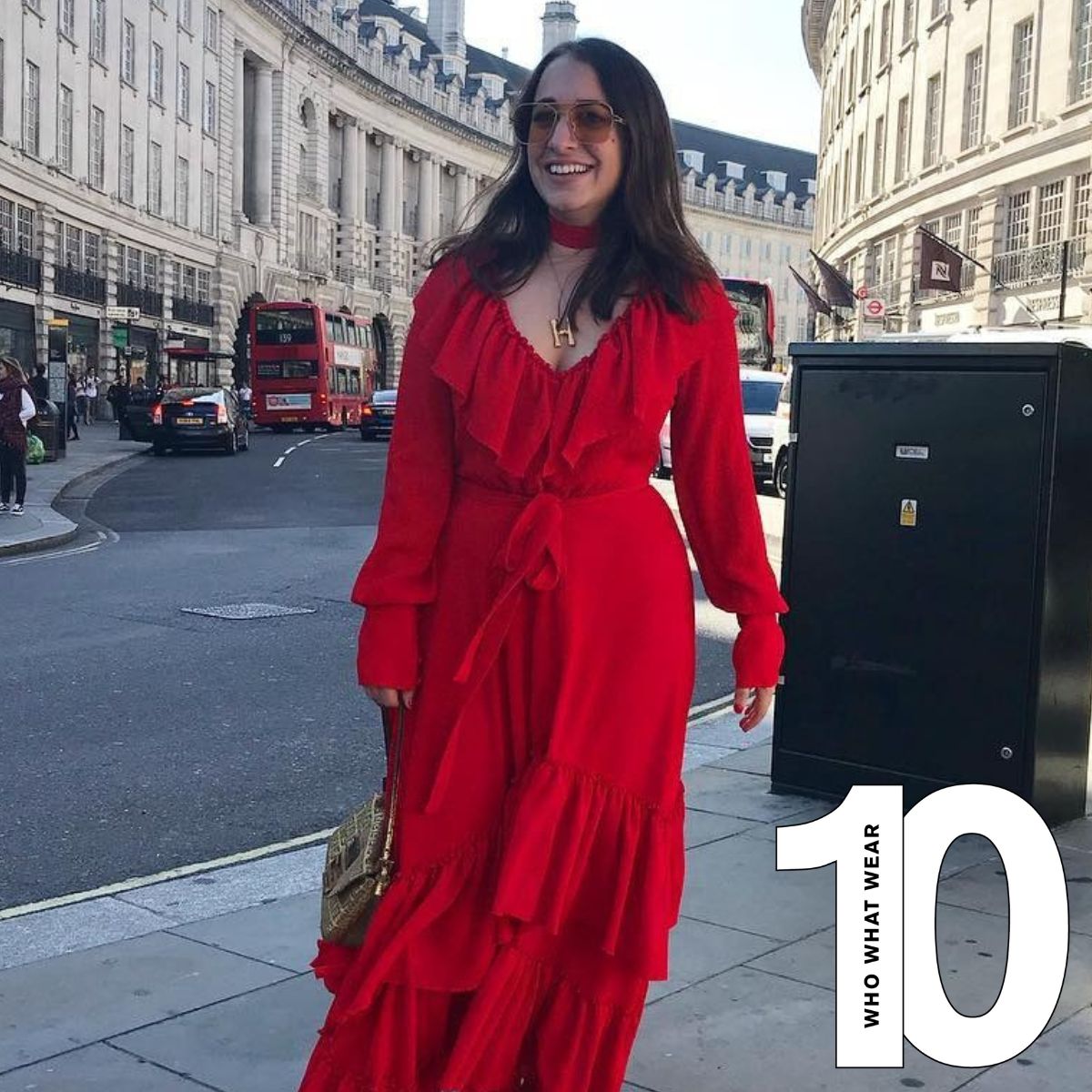 Woman wears red dress, sunglasses and gold necklace