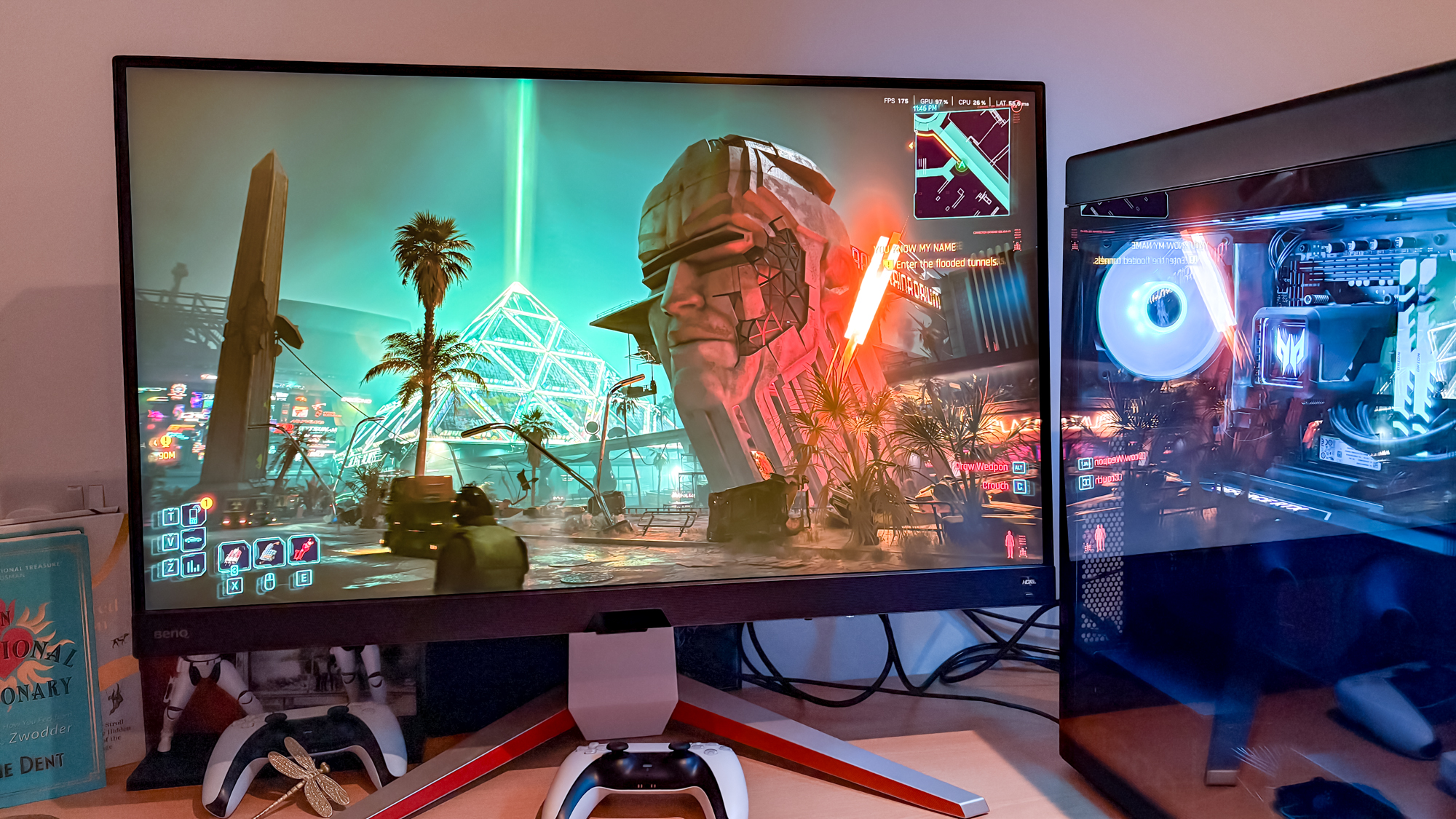 Acer Predator Orion 7000 on desk with Cyberpunk 2077 on monitor next to it