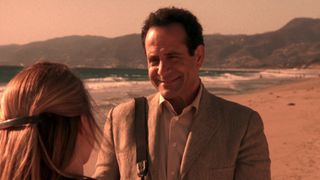 Tony Shalhoub on a beach during Monk finale