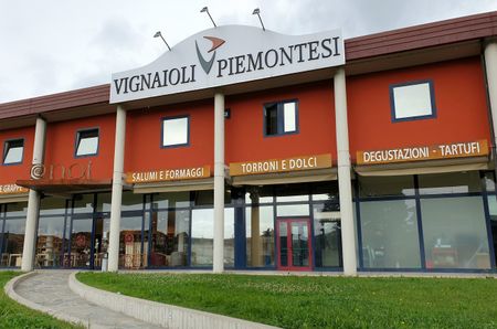 Red building with 'Vignaioli Piemontesi' sign