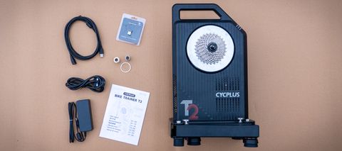 the Cycplus T2 laid down on a brown surface with all its accessories
