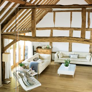 living room with wooden beams and wooden flooring