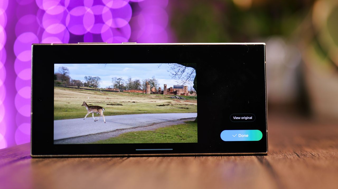 Photo displayed on a Samsung Galaxy S24 Ultra phone screen with purple lights blurred in the background