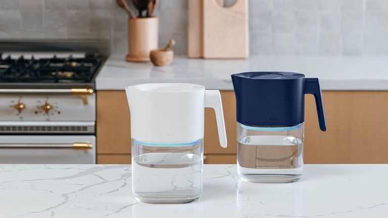 LARQ Pitcher PureVis™ best water filter pitcher in white and blue, on white marble countertop