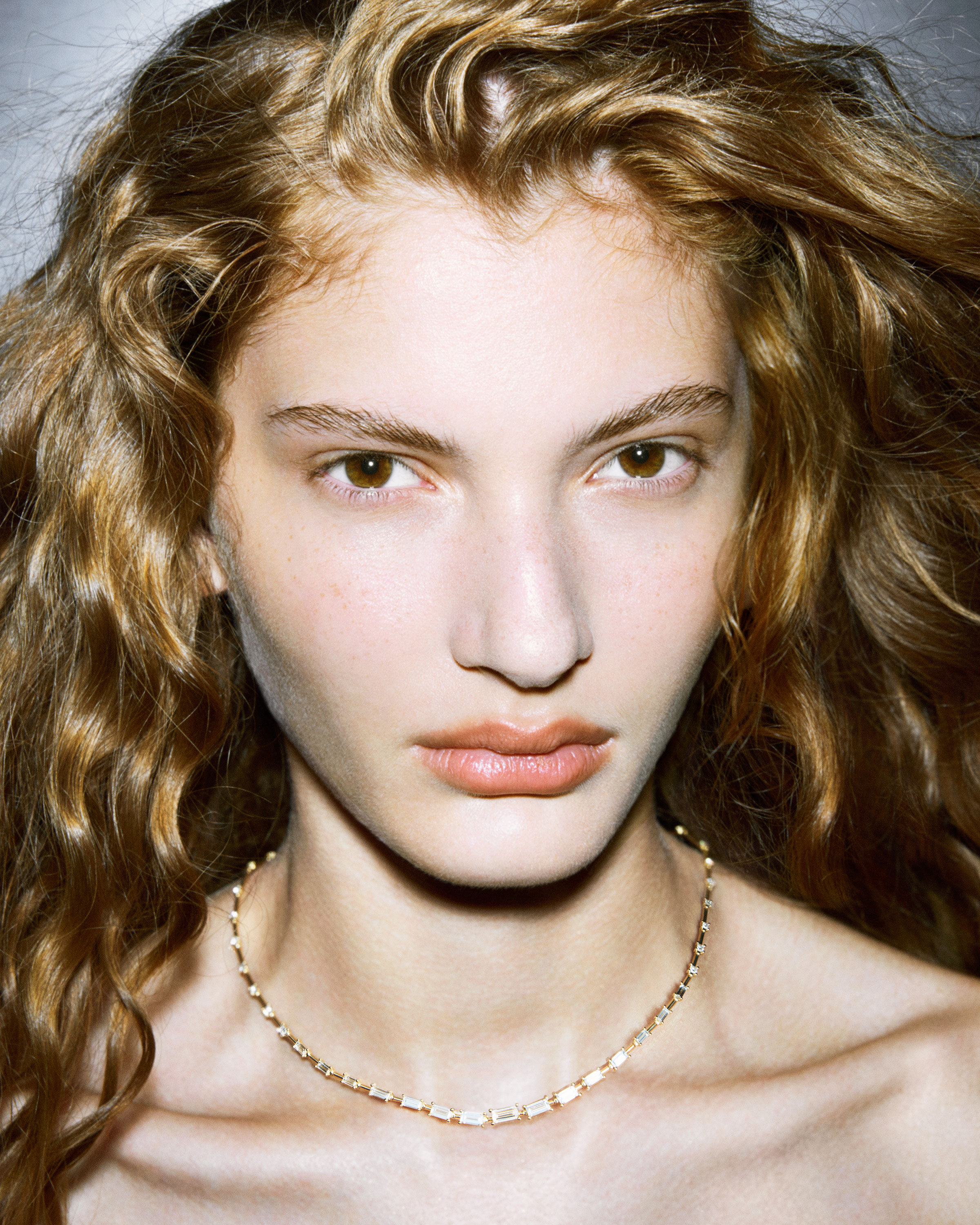 woman wearing diamond necklace