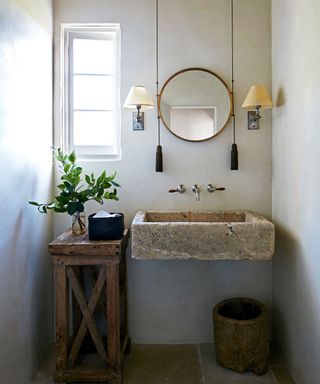 powder room with antique French limestone sink
