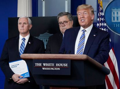 Donald Trump with Mike Pence and William Barr.