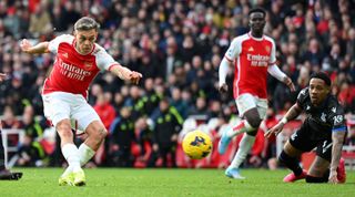 LONDON, ENGLAND - JANUARY 20: Leandro Trossard of Arsenal scores his team's third goal during the Premier League match between Arsenal FC and Crystal Palace at Emirates Stadium on January 20, 2024 in London, England. (Photo by Shaun Botterill/Getty Images)