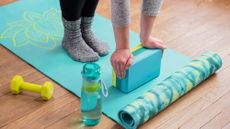 Best yoga blocks: Woman using yoga block as a prop