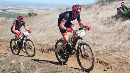 Cadel Evans and George Hincapie compete in the 2017 Cape Epic MTB race,