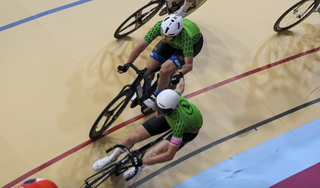 Ashlin Barry and Enzo Edmonds use a hand exchange during elite men's race at 2024 USA Cycling Madison Track National Championships