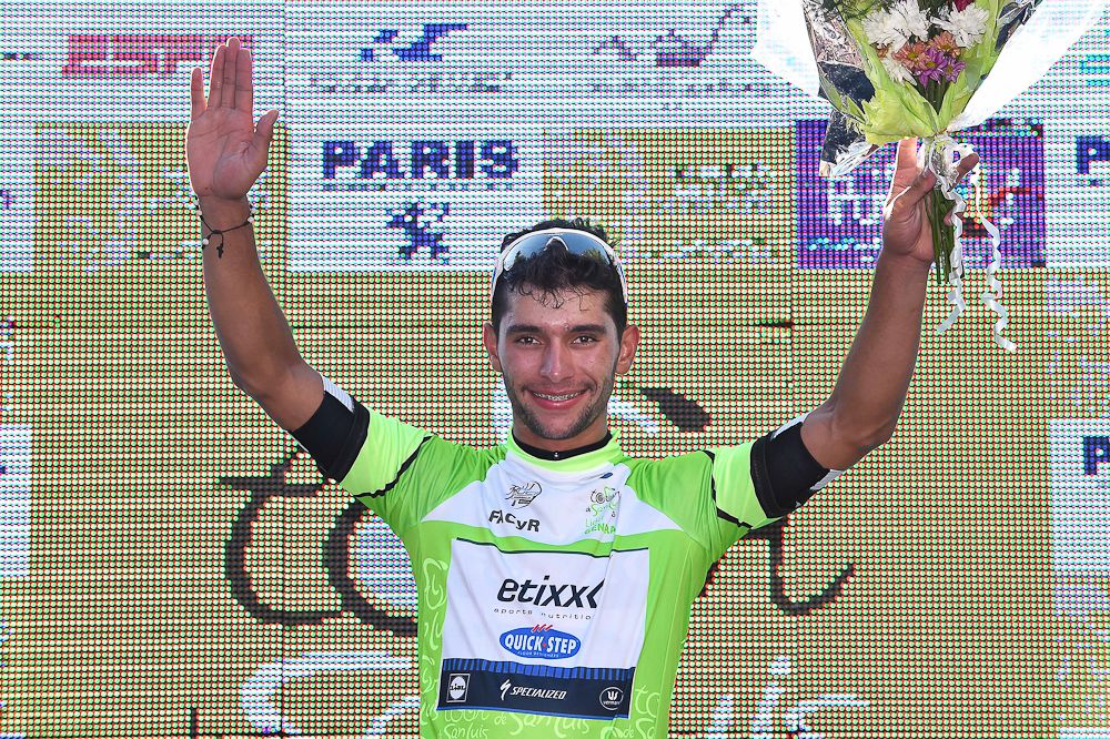 Fernando Gaviria in the race leader's jersey on the stage 2 podium.