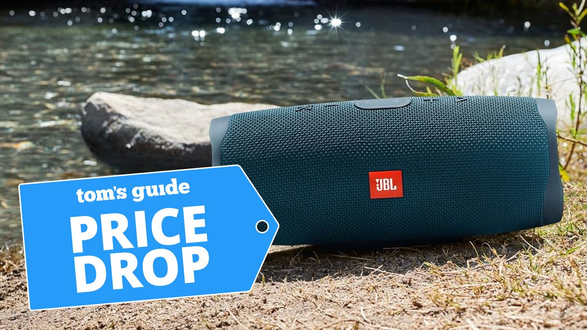 JBL Charge 4 shown on grass next to lake