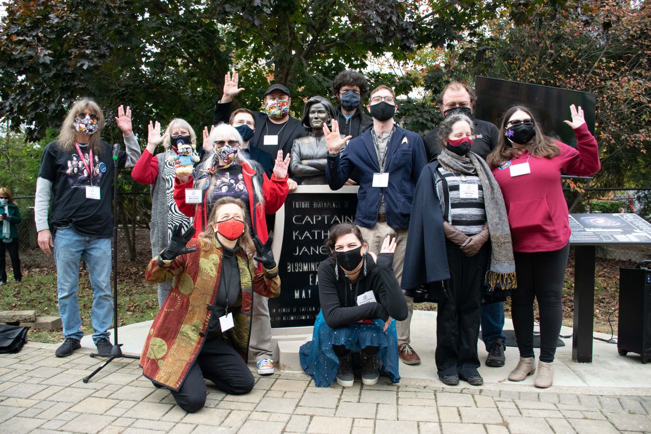 The Captain Janeway Bloomington Collective, the fan group behind the statue, celebrates the monument's unveiling Oct. 24, 2020.