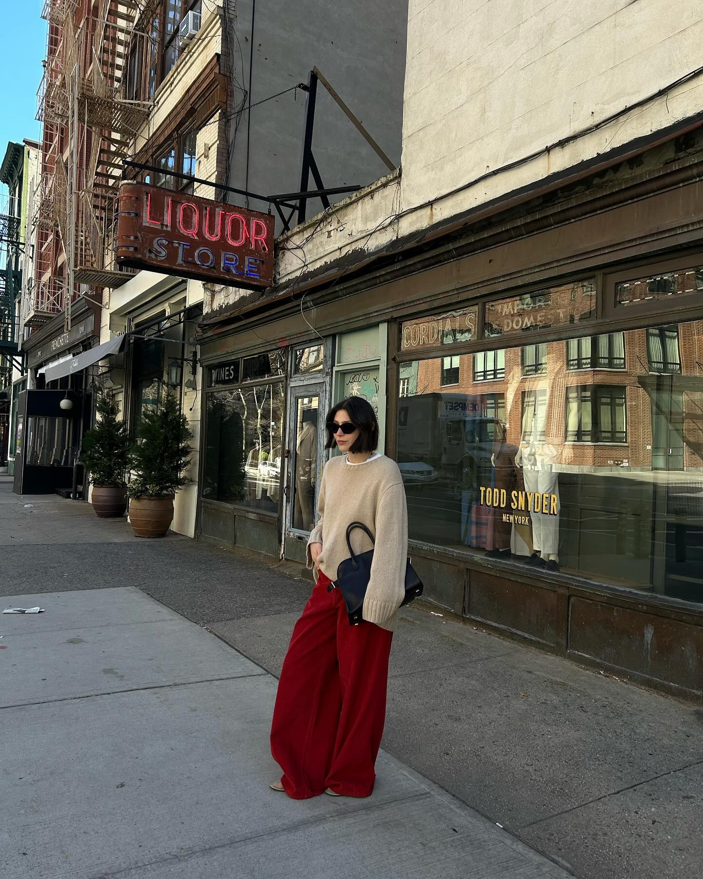 Woman wearing bootcut jeans, a spring 2026 jean trend.