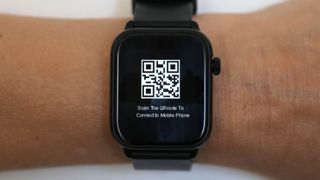 Xplora XMOVE displaying QR code for connecting the watch to a smartphone