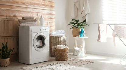 A front loading washing machine in a laundry room