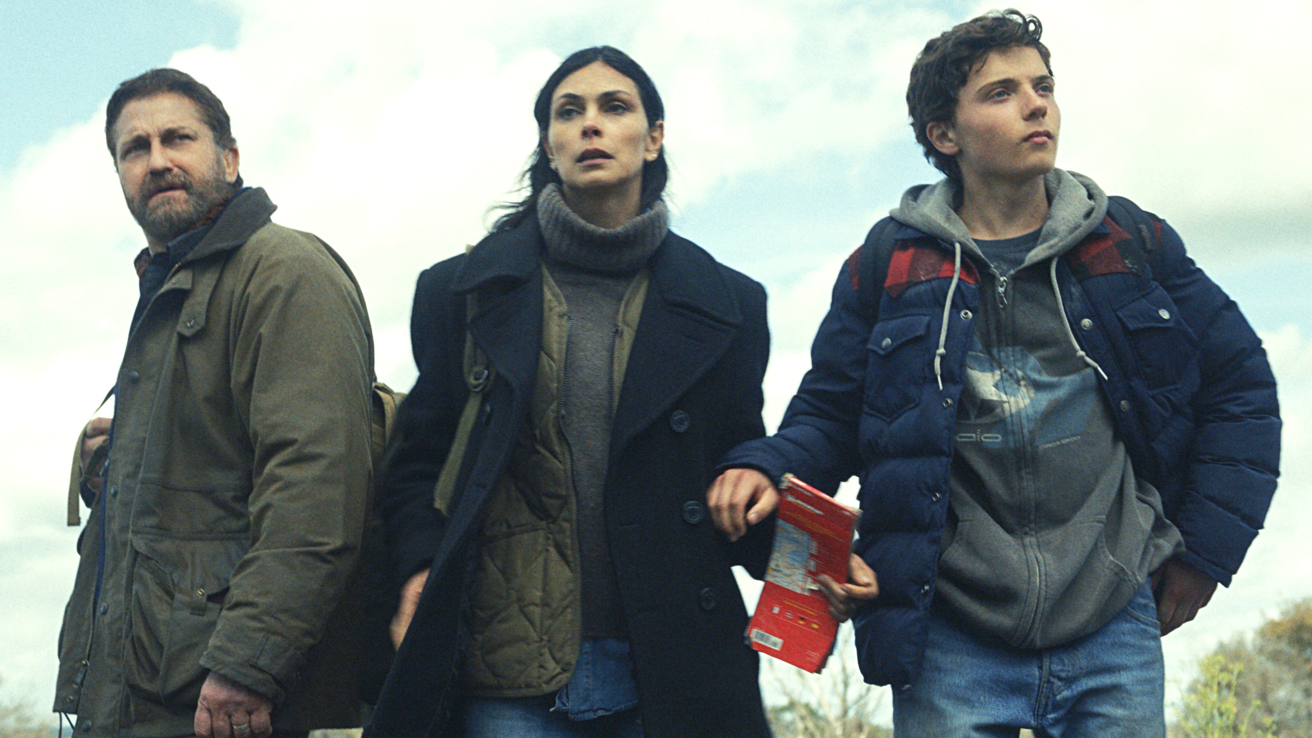 (L-R) Gerard Butler, Morena Baccarin and Roman Griffin Davis as John, Allison and Nathan Garrity in "Greenland 2: Migration" (2026).