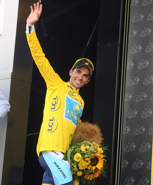 Alberto Contador leaves the podium resplendent in yellow.