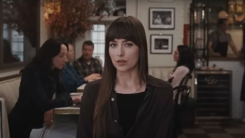 Dakota Johnson in Materialists talking to a client inquisitively. 