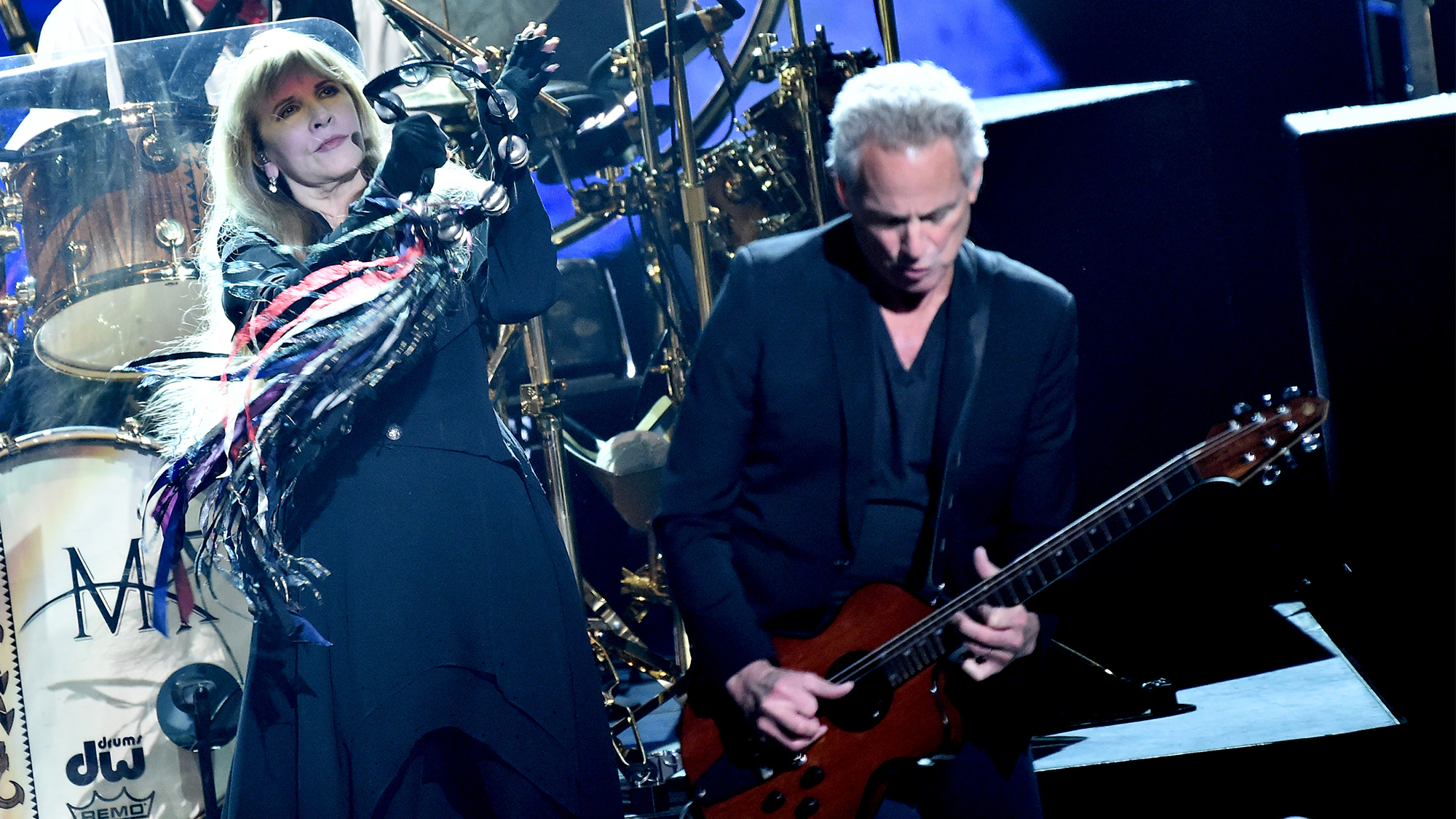 Honorees Mick Fleetwood (on drum riser), Stevie Nicks, and Lindsey Buckingham of music group Fleetwood Mac perform onstage during MusiCares Person of the Year honoring Fleetwood Mac at Radio City Music Hall on January 26, 2018 in New York City.