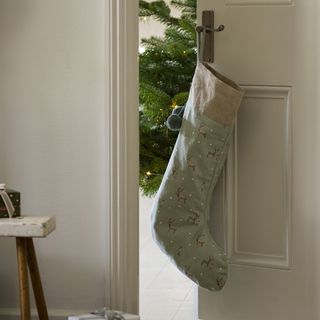 Christmas stocking hanging on door