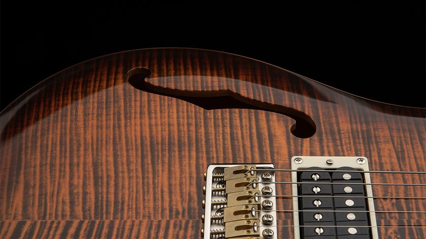 A detail photo of the PRS SE Custom 24 Semi-Hollow Piezo in Orange Tiger Smokeburst finish