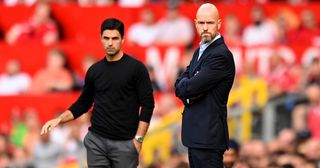 Manchester United and Arsenal managers Erik ten Hag and Mikel Arteta look on during the Premier League match between Manchester United and Arsenal FC at Old Trafford on September 04, 2022 in Manchester, England.