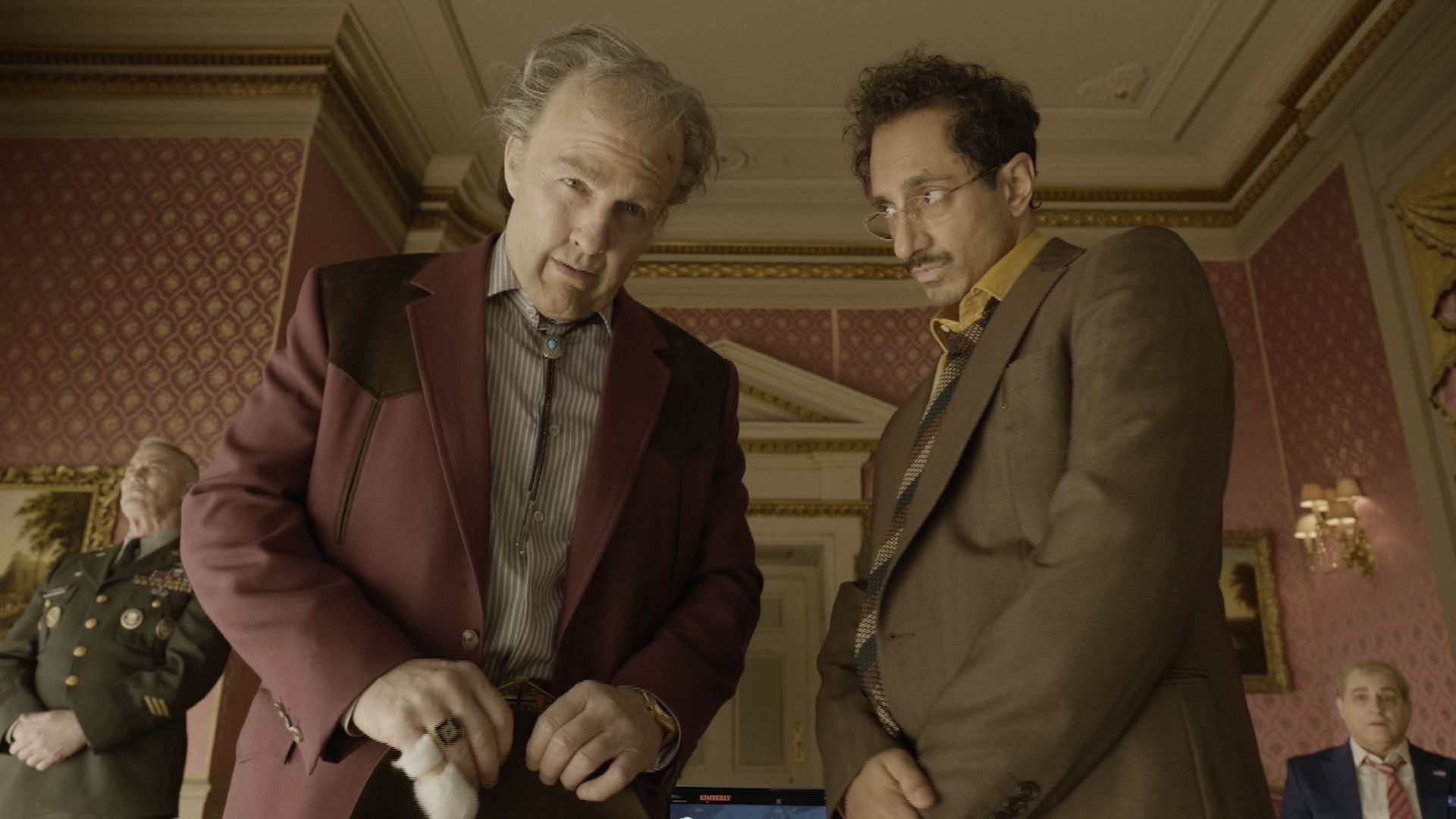 Tom Cruise and Riz Ahmed standing together in Digger