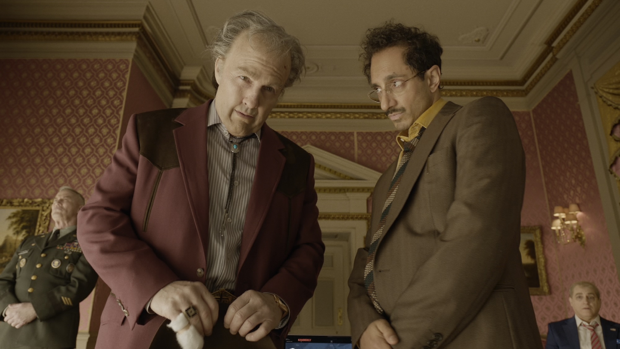 Tom Cruise and Riz Ahmed standing together in Digger