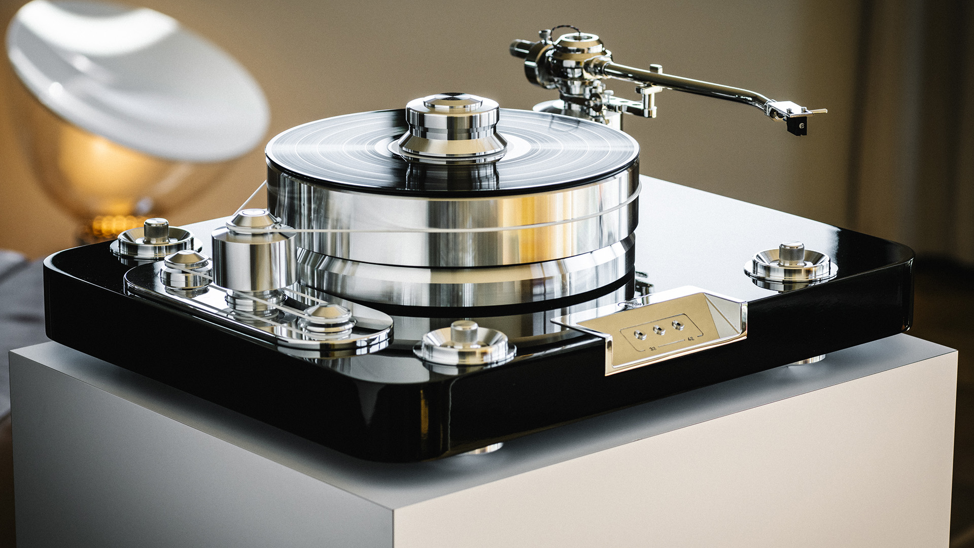 Pro-Ject Signature 12.2 turntable on a white plinth