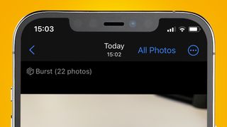 An iPhone on a yellow background showing a burst of photos