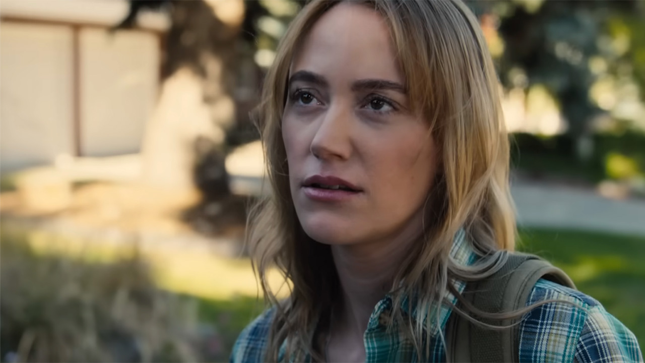 Maika Monroe in a plaid shirt and looking upset as her character tries to see her daughter in Reminders of Him. 