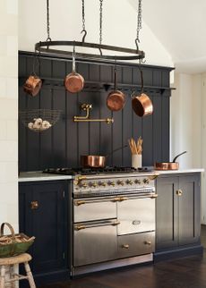 navy shaker kitchen with pot hanging rack
