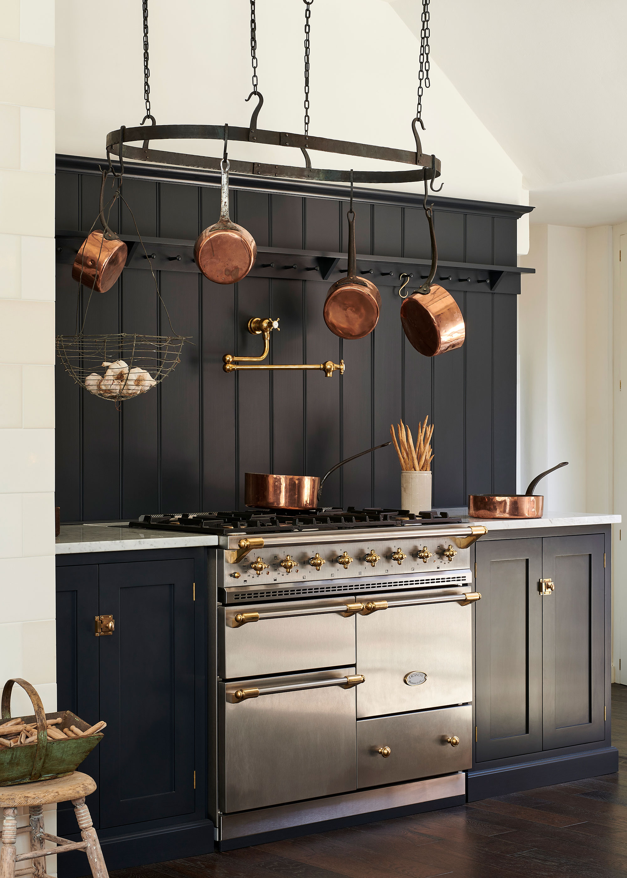 navy shaker kitchen with pot hanging rack