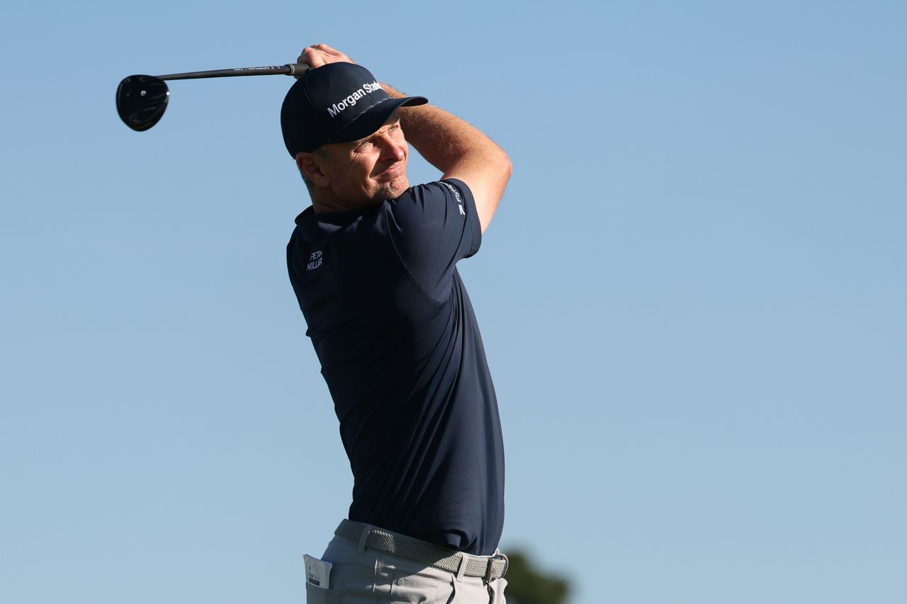 Justin Rose hits a fairway wood off the tee