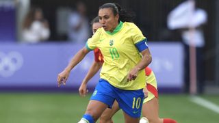 Marta on the ball for Brazil, in a yellow shirt and blue shirts, in the women's soccer at the 2024 Paris Olympic Games.