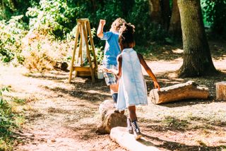 garden play area ideas: logs as stepping stones