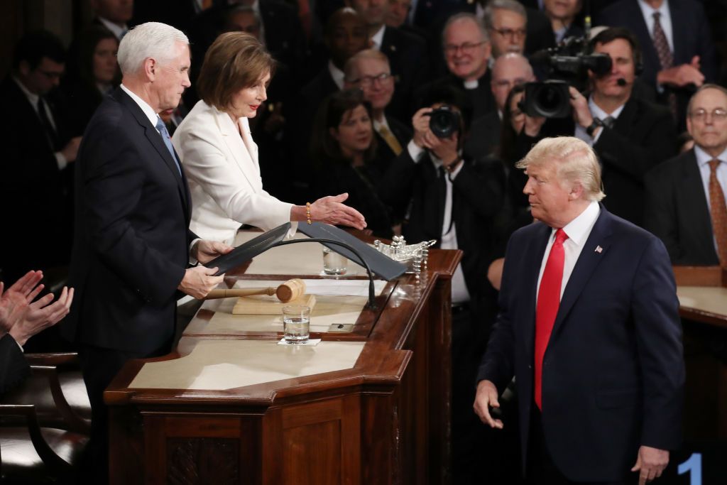 Nancy Pelosi reaches out to shake Trump&amp;#039;s hand.