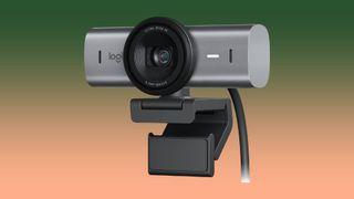 Logitech MX Brio Ultra 4K Webcam against green and orange gradient background