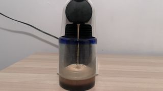 Nespresso pod coffee machine brewing a coffee
