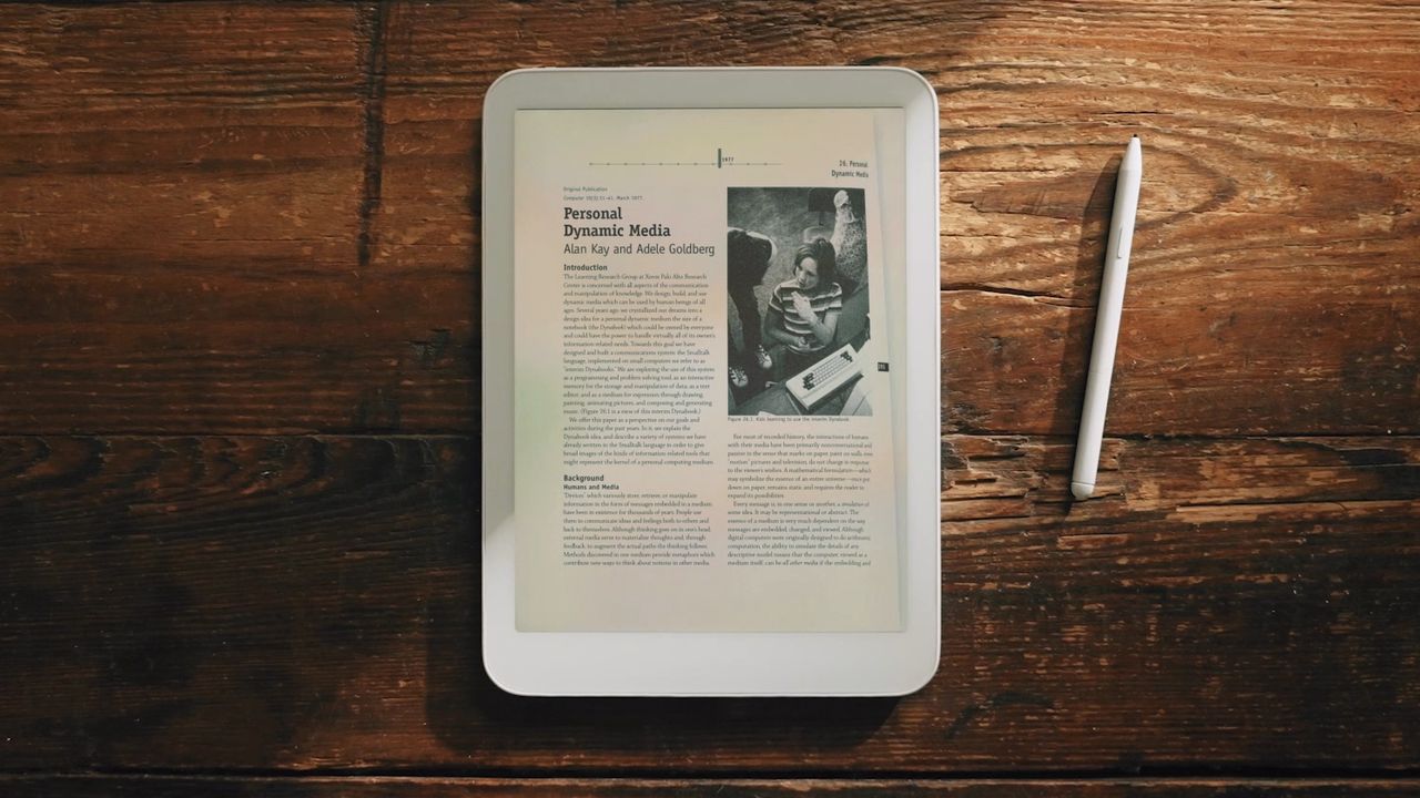 The Daylight DC-1 tablet sitting on a table next to a stylus