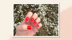 A close-up shot of a pristine red manicure on senior beauty editor Rhiannon Derbyshire's nails, to illustrate the look of a Ukrainian manicure