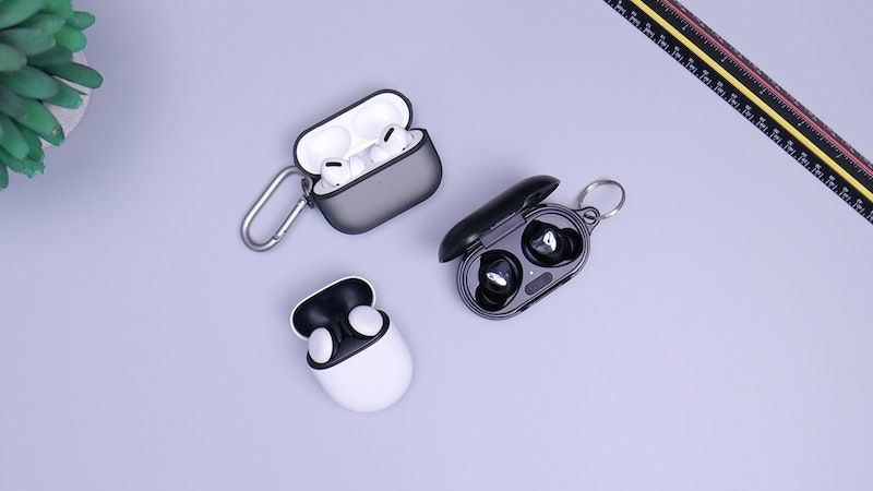 three in-ear headphones on desk