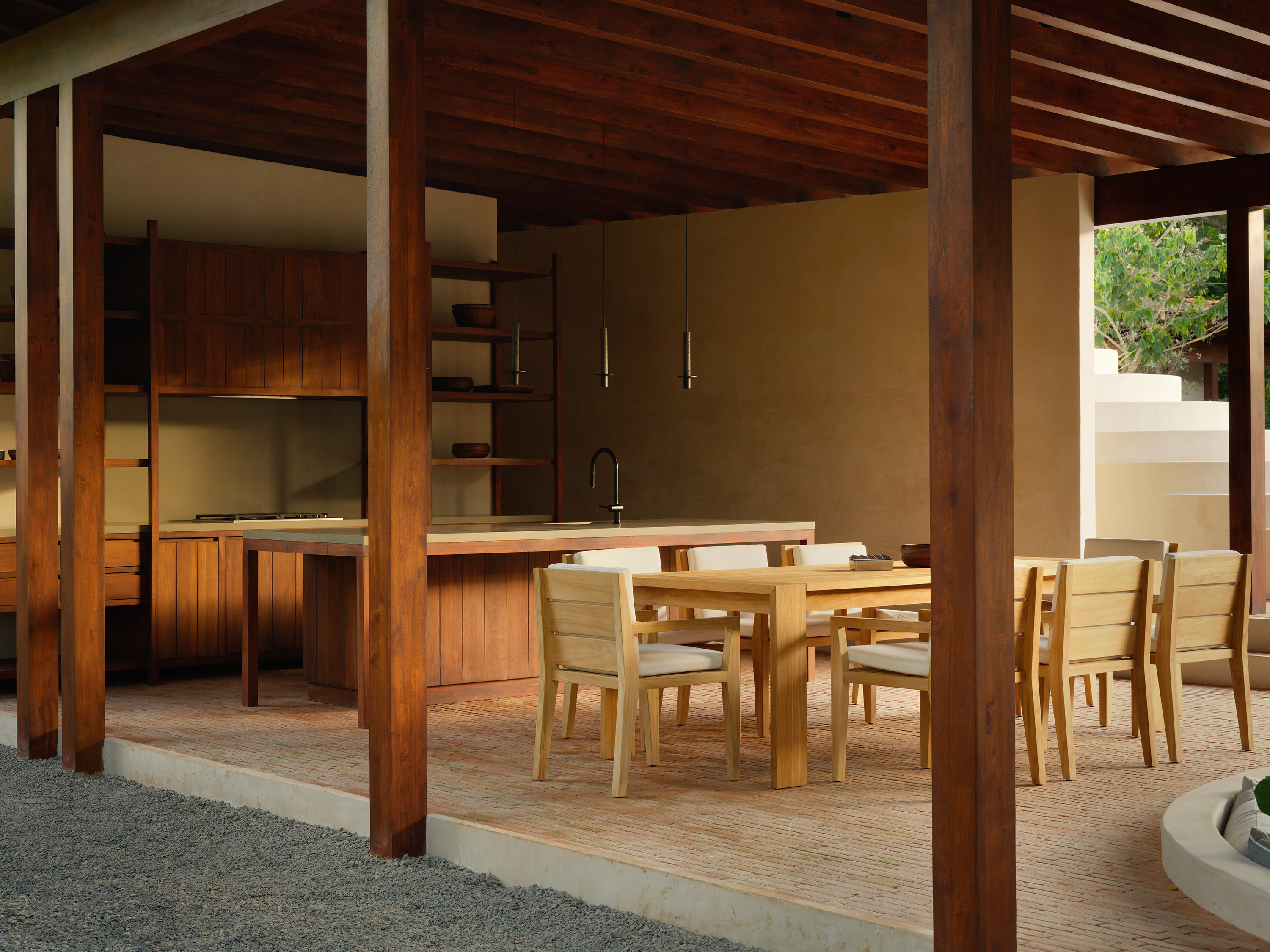 a sculptural Patio house in Costa Rica, textured, low volumes among tropical greenery
