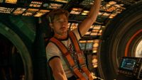 an astronaut on the bridge of a spaceship