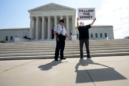 Protester in front of Supreme Court