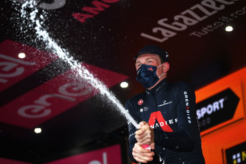 PIANCAVALLO ITALY OCTOBER 18 Podium Tao Geoghegan Hart of The United Kingdom and Team INEOS Grenadiers Celebration Champagne during the 103rd Giro dItalia 2020 Stage 15 a 185km stage from Base Aerea Rivolto Frecce Tricolori to Piancavallo 1290m girodiitalia Giro on October 18 2020 in Piancavallo Italy Photo by Tim de WaeleGetty Images