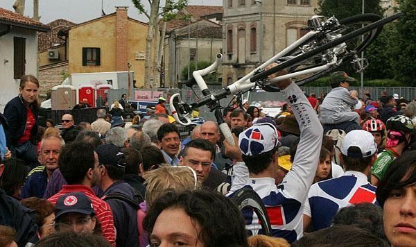 Francaise des Jeux riders squeeze through the crowd.